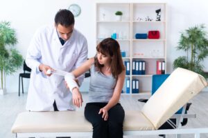 wound specialist dressing a patient’s arm